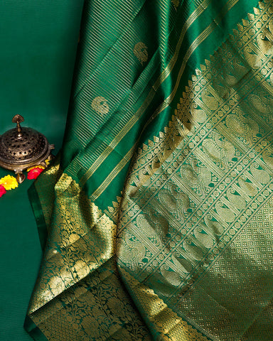 The green Kanjivaram silk saree - PattuCheeralu